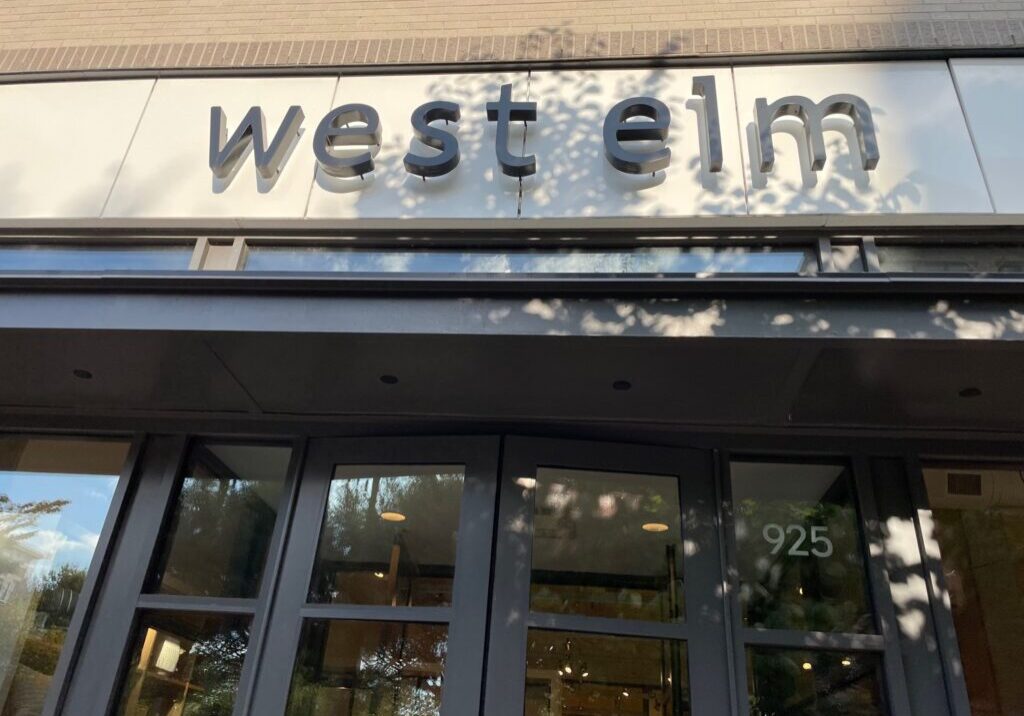 A building that has west elm on the front of it.