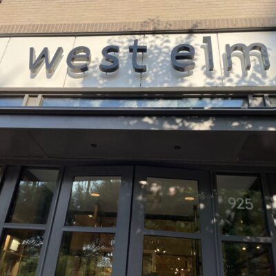 A building that has west elm on the front of it.